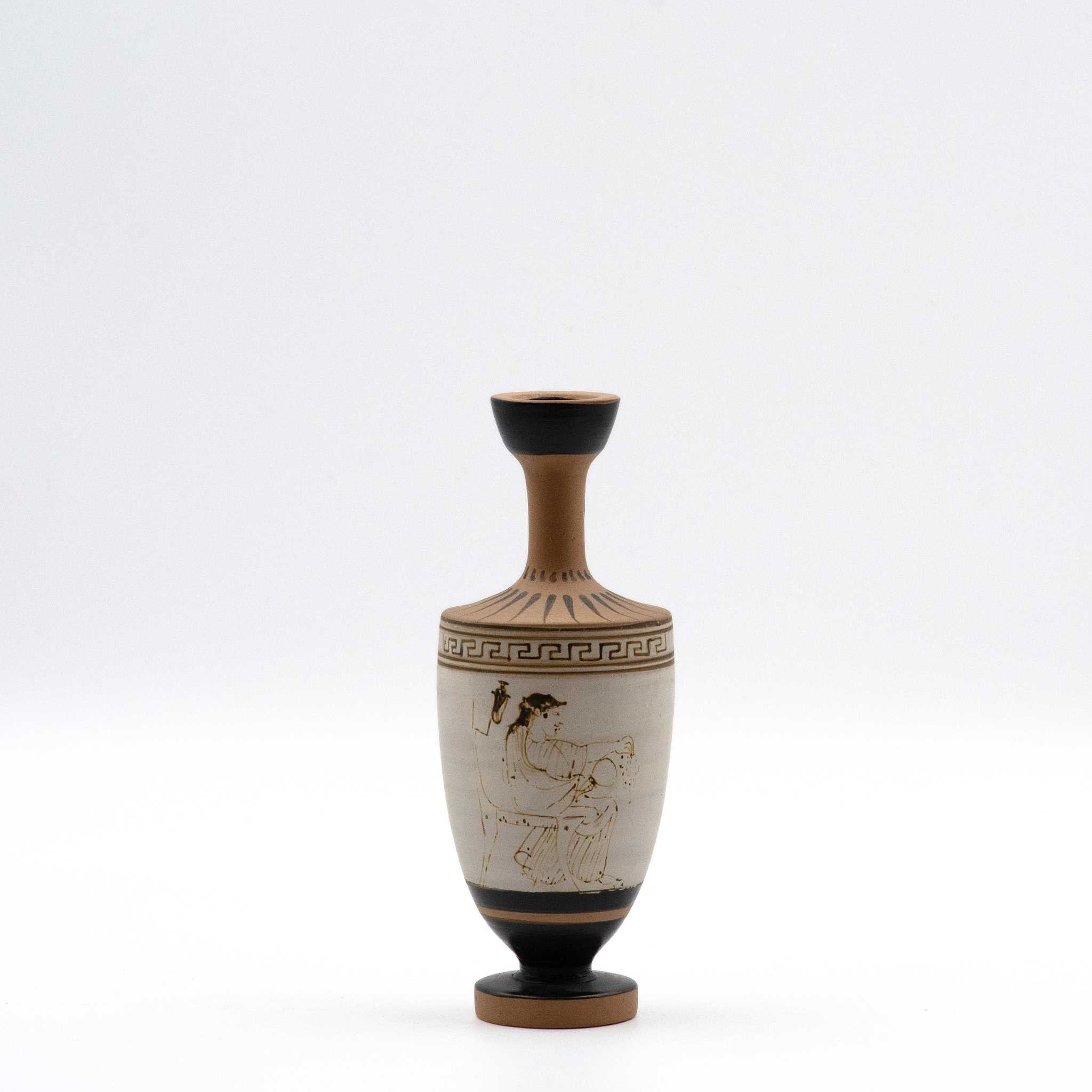 White lekythos with a seated woman
