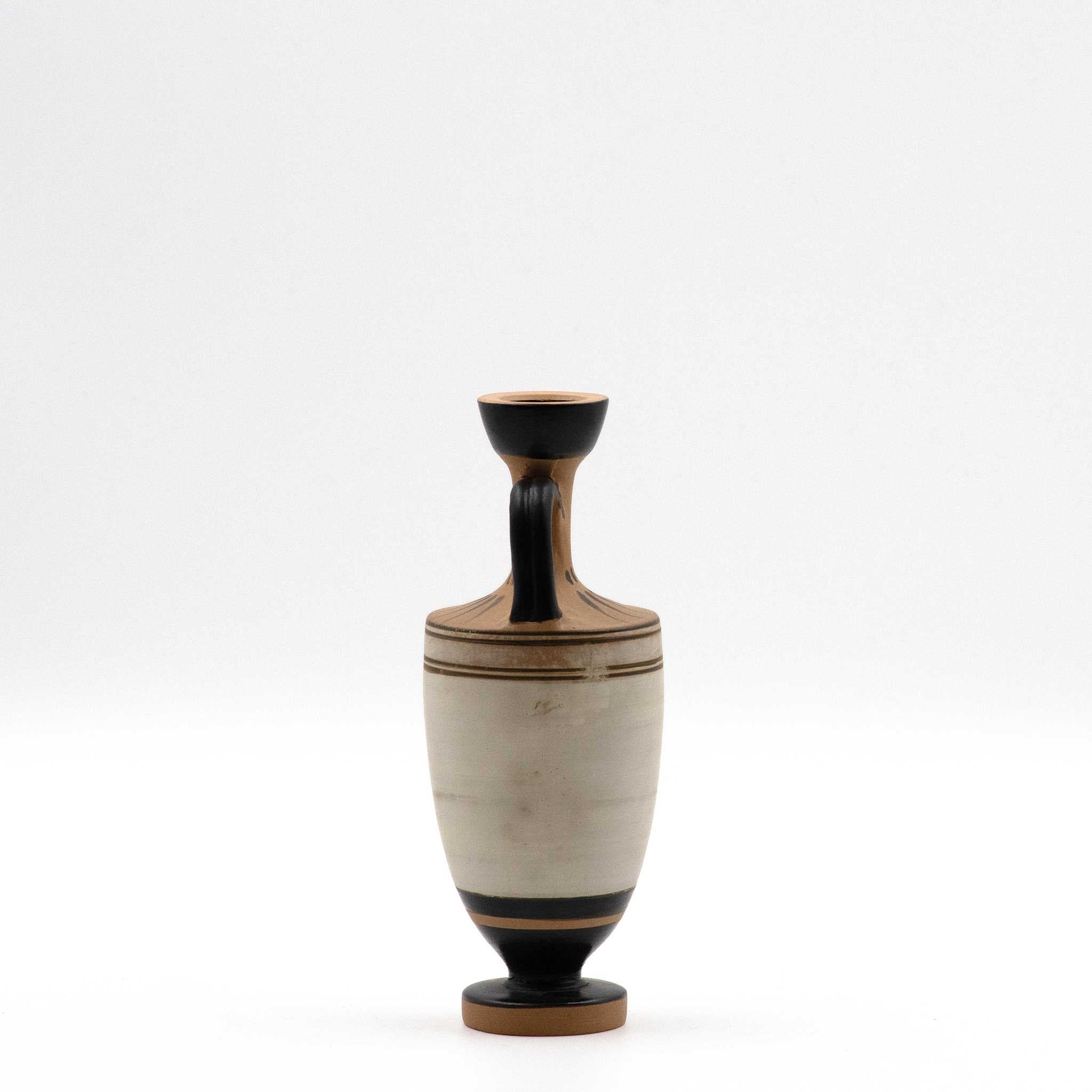 White lekythos with a seated woman