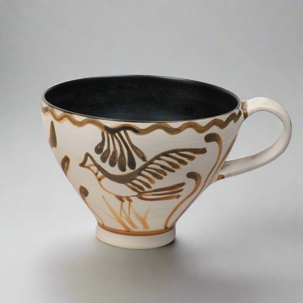 White painted mug with a bird motif