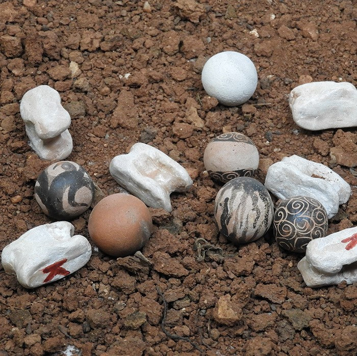 Knucklebones (astragaloi) and marbles (spheria) made of clay