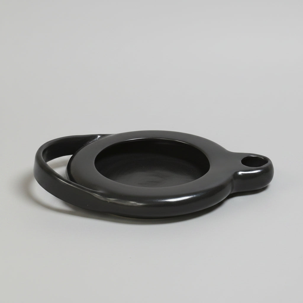 black ceramic oil lamp