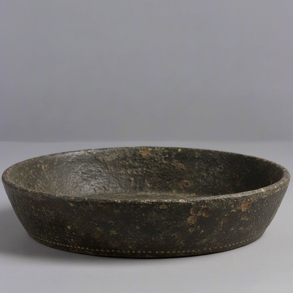 Black ceramic bowl on a gray background