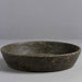 Black ceramic bowl on a gray background