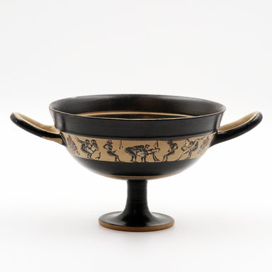 This image displays a finely crafted Black-Figure Kylix, featuring a band of miniature decoration that illustrates intimate scenes of men and women. The kylix, originating from ancient Greece, circa 550–500 BC, bears the marks of black-figure pottery with its elegant and stylized depiction of the erotic scenes.