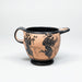 Ceramic cup with black floral and leaf designs on a white background