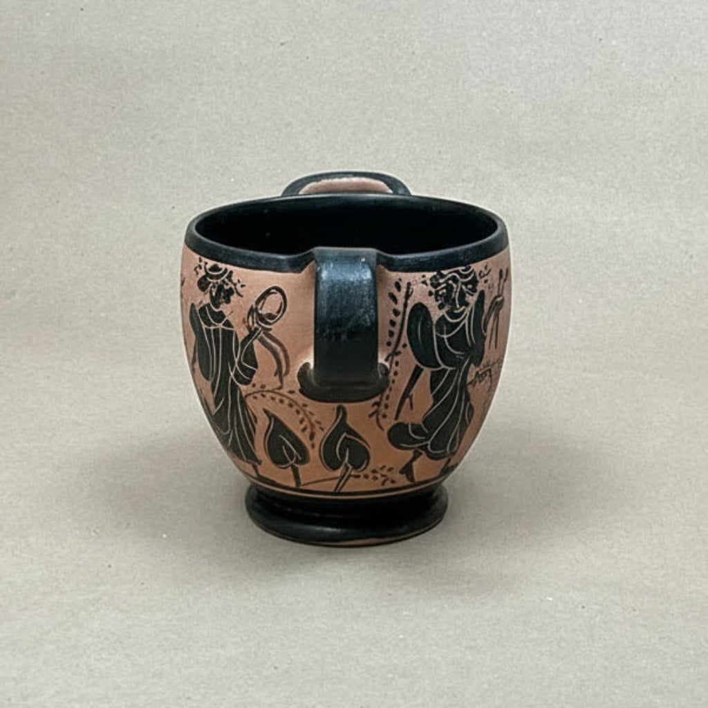 Ceramic mug with black decorative patterns on a beige background
