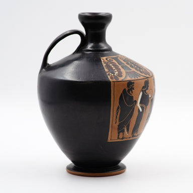 An ancient Greek black figure lekythos with a depiction of two figures on the side.