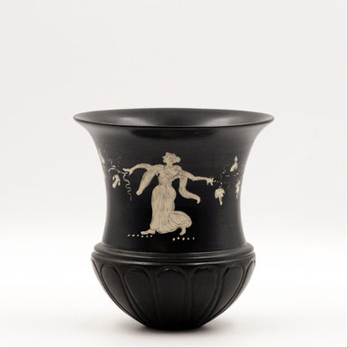A black glaze ceramic calyx cup with a white decoration of a nymphe based on a small Gnathia oinochoe of the 4th cent. BCE.