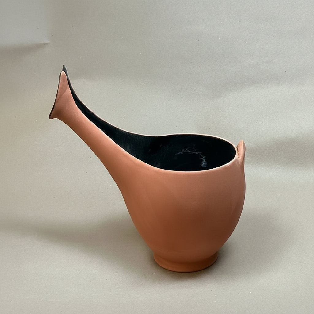 Ceramic vase with a unique design on a plain background