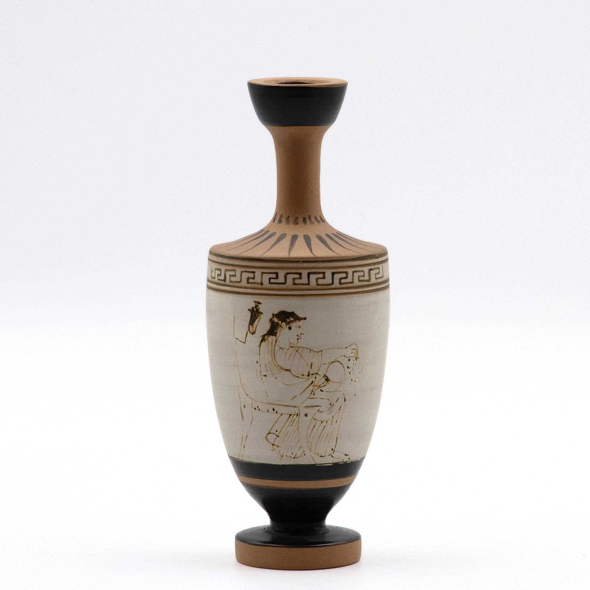 White lekythos with a seated woman
