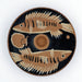 Red figure ceramic plate with fish design on a white background