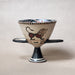 Ceramic bowl (chalice) with a decorative design of a lion on a white beige background
