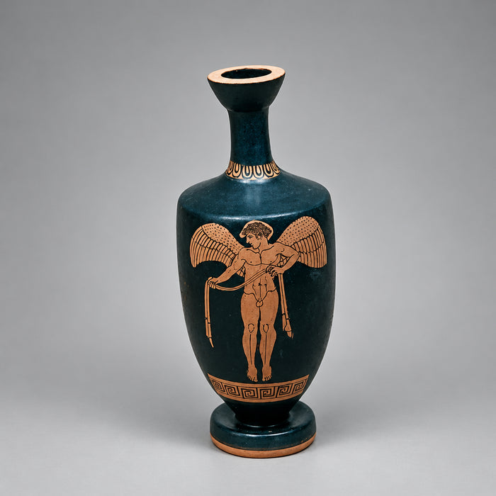 Black vase with red decorative figure on a gray background