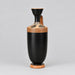 A black ceramic vase with a flared neck, a side handle, and a terracotta-colored base decorated with black geometric and floral patterns, set against a neutral beige background.