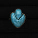 Turquoise stone ring with silver band on a black background