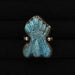 Blue ceramic ring with gold accents on a black background