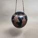 Decorative black hanging egg shaped ceramic trinket box with refigure decoration 