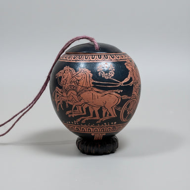 Decorative urn with classical design on a white background