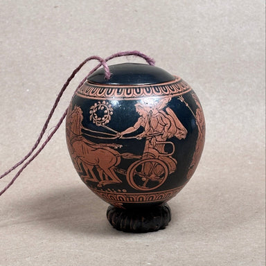 Decorative urn with classical design on a neutral background