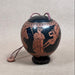 Decorative object with intricate designs on a light gray background