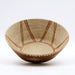 Hand-built ceramic bowl with band flame decoration on a white background