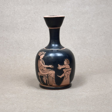 Black vase with red-figure decoration of two figures on a gray background