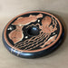Decorative plate with fish and octopus design on a beige background