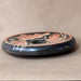 Decorative ceramic plate with fish design on a beige background