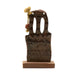 Decorative wooden object with intricate carvings on a white background