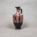 Ceramic vase with black-figure design on a gray background