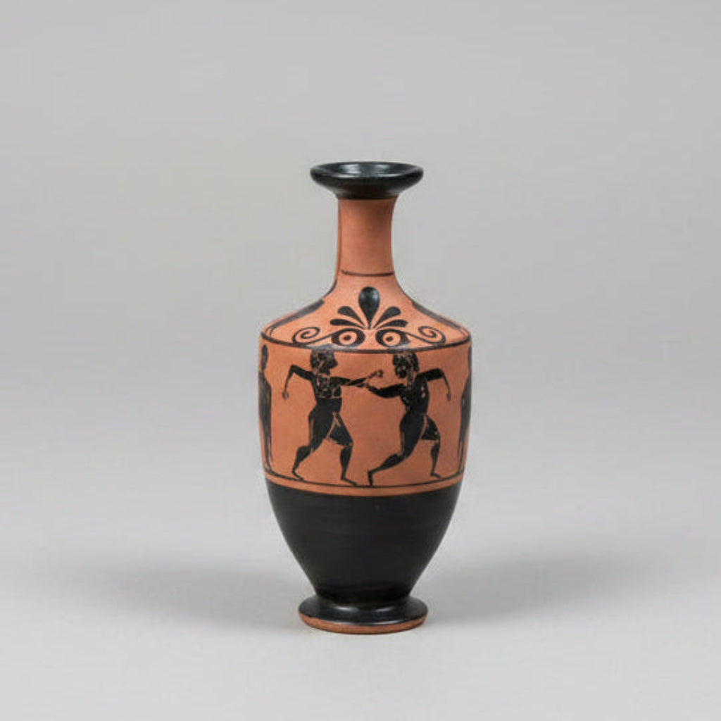 Vase with black and red designs on a gray background