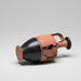 Ceramic vase with black and red design on a gray background
