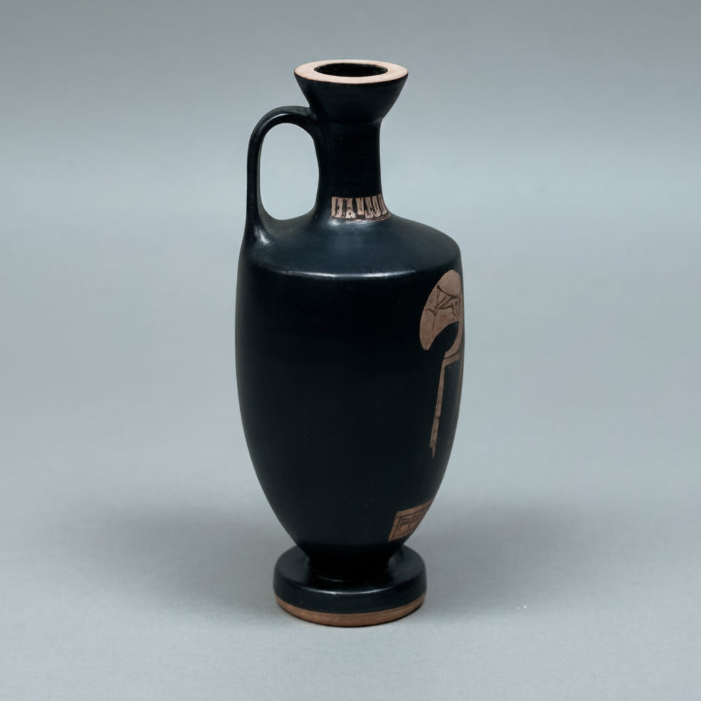 Black ceramic vase with red decorative patterns on a gray background