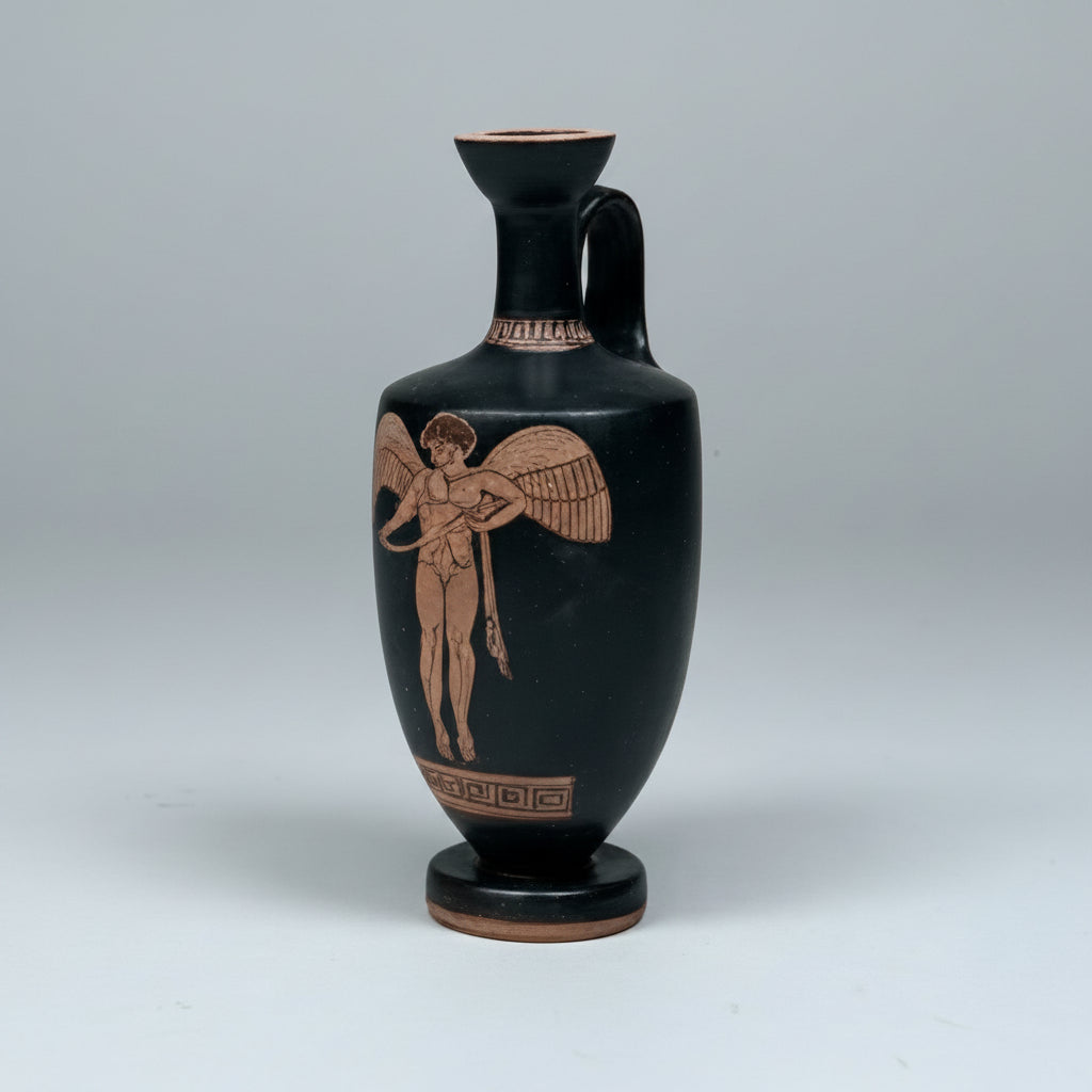 Black vase with brown decorative figure on a gray background