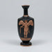 Black vase with red decorative figure on a gray background