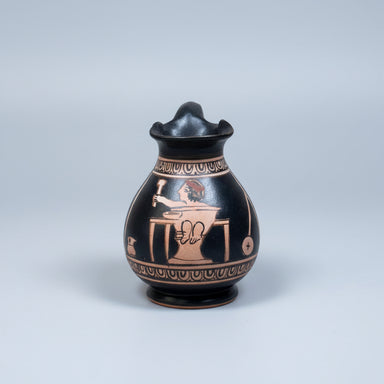 Ceramic vase with decorative design on a light gray background