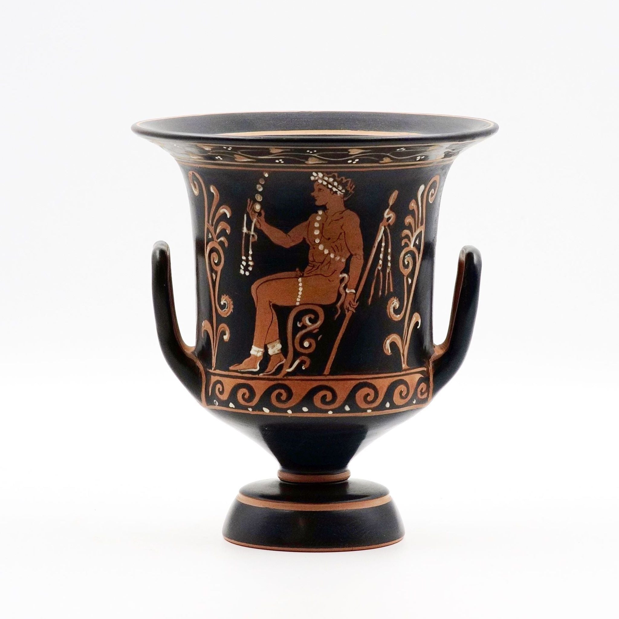 A black and red decorated wheel-thrown ceramic vase with a design of a satyr and a youth