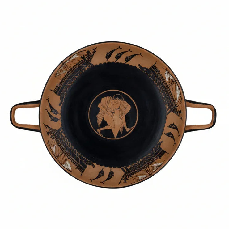 A black and red figure Kylix with youth lifting a amphora and galleys sailing on waves, with a wreath and a red band on the lip.