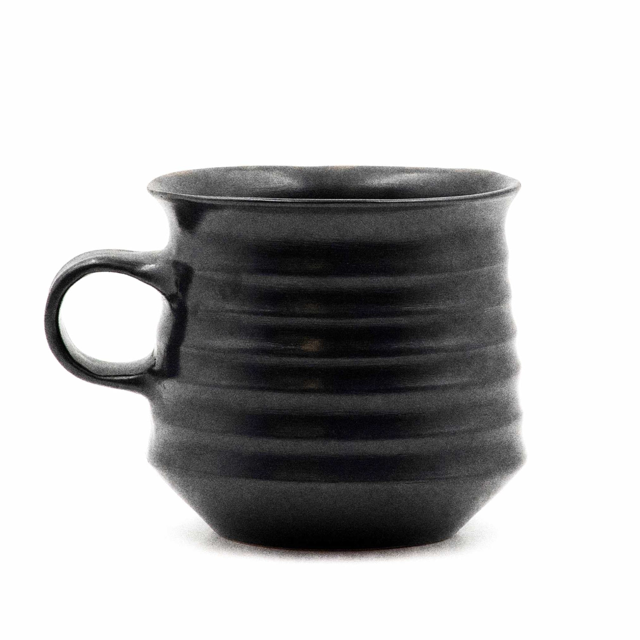 Black glazed ribbed mug with a handle, based on an ancient design from the Ancient Agora of Athens.