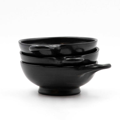 A black glazed shallow one-handle skyphos.
