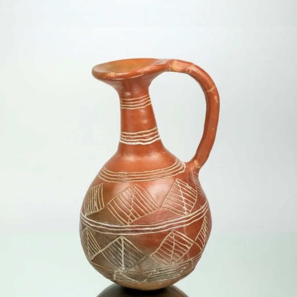 A Cypriot red polished ceramic flask with geometric patterns.