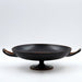 Hand-thrown black ceramic kylix bowl with two handles and pedestal base on white background