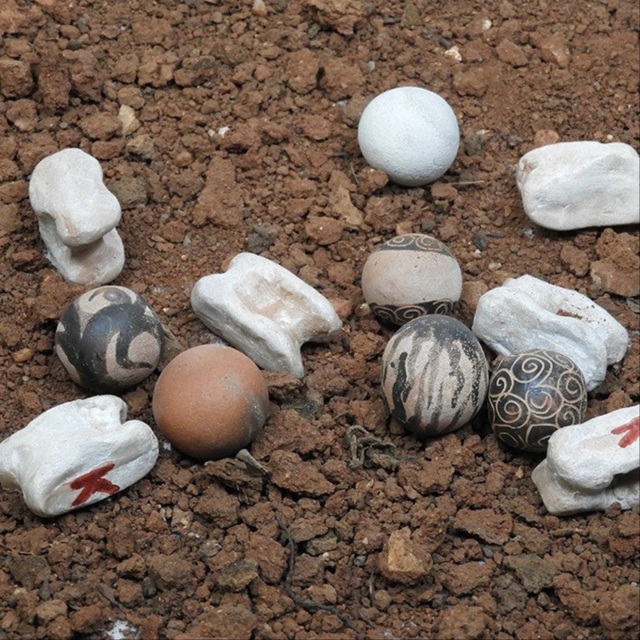 Knucklebones (astragaloi) and marbles (spheria) made of clay