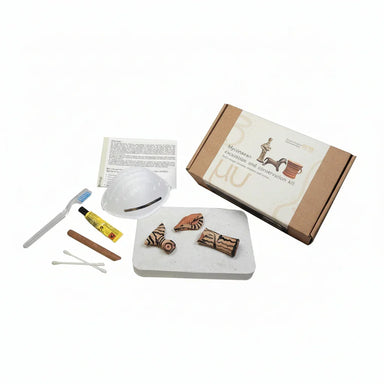 Mycenaean excavation and conservation kit with painted pottery shards and tools
