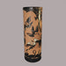 A black cylindrical vase with floral and animal patterns