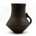 This image features a large, grey hand-built vase, crafted as part of the exclusive "Thetis Cabinet" collection. Displayed against a plain background to emphasize its design, the vase exhibits a rich, matte grey finish with a distinctive shape that tapers towards the base and flares slightly at the top.