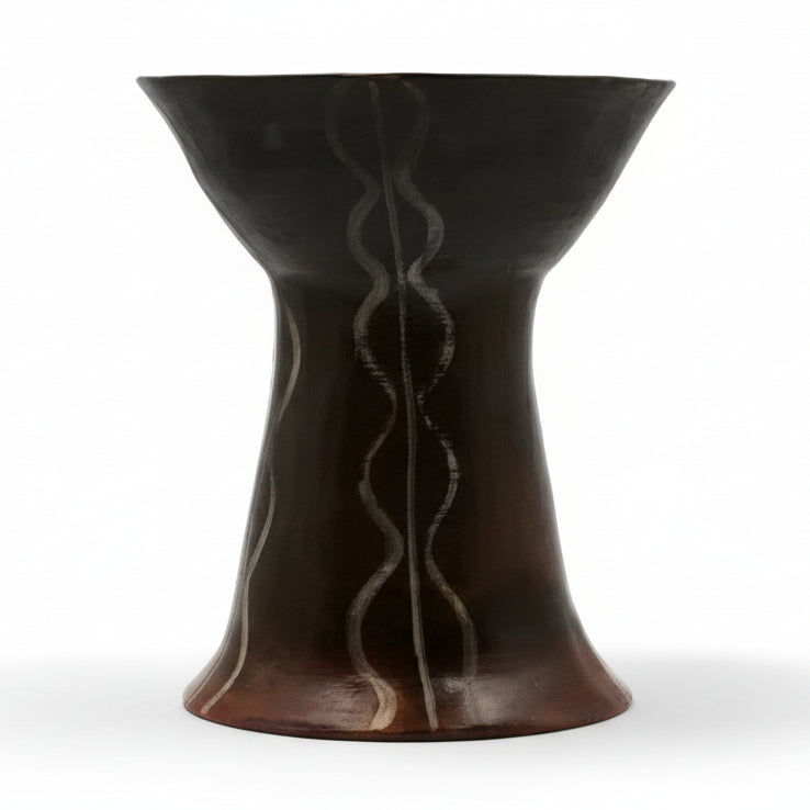 This image features a striking tall pedestal vase, handcrafted and inspired by a 5th millennium BC original from Saliagos, Greece. The vase, made in 2005, is a product of the THETIS Cabinet and showcases visible signs of wear with professional restoration in 2020.