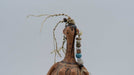 Decorative figurine with intricate patterns on a plain background