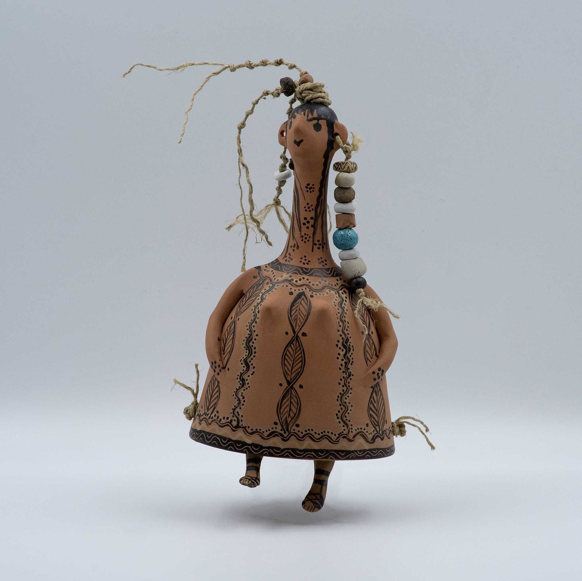 Decorative figurine with intricate patterns on a plain background