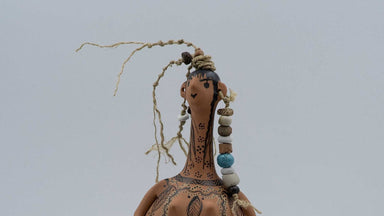 Decorative figurine with intricate patterns on a plain background